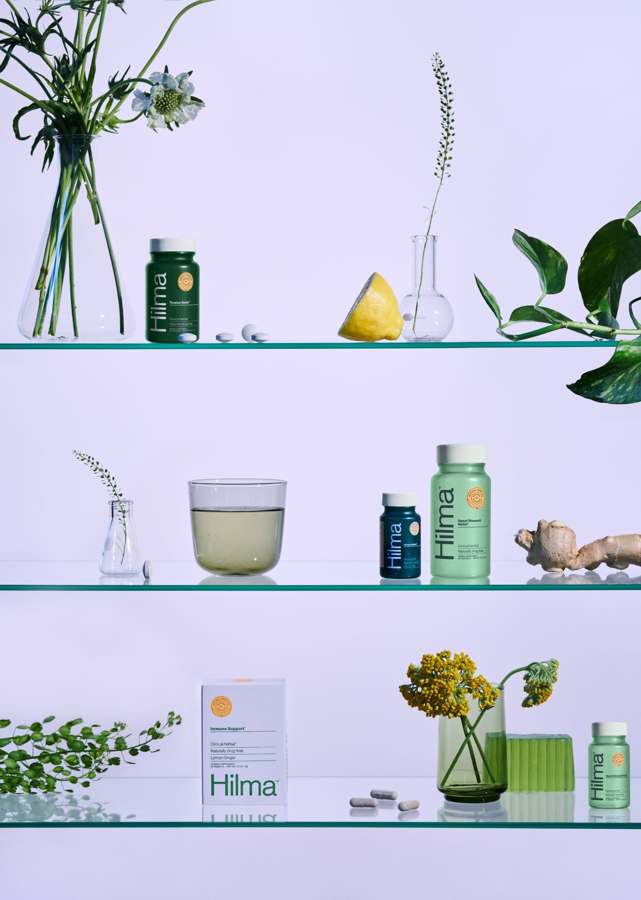 Hilma supplements arranged on shelving with botanical accents.