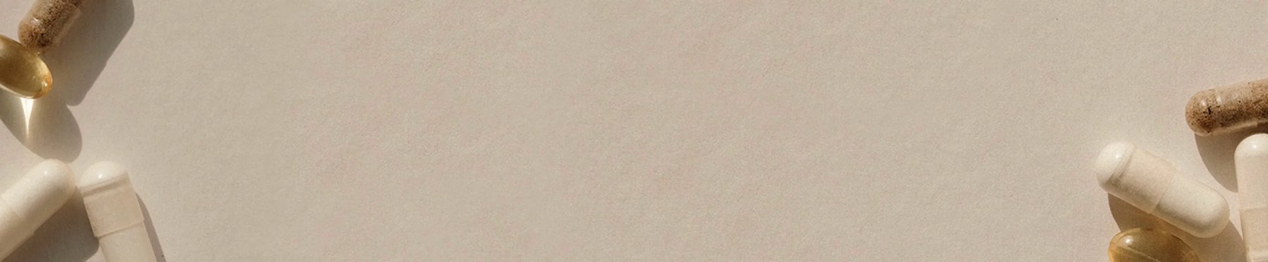 Assorted Perelel pills scattered across light beige background.