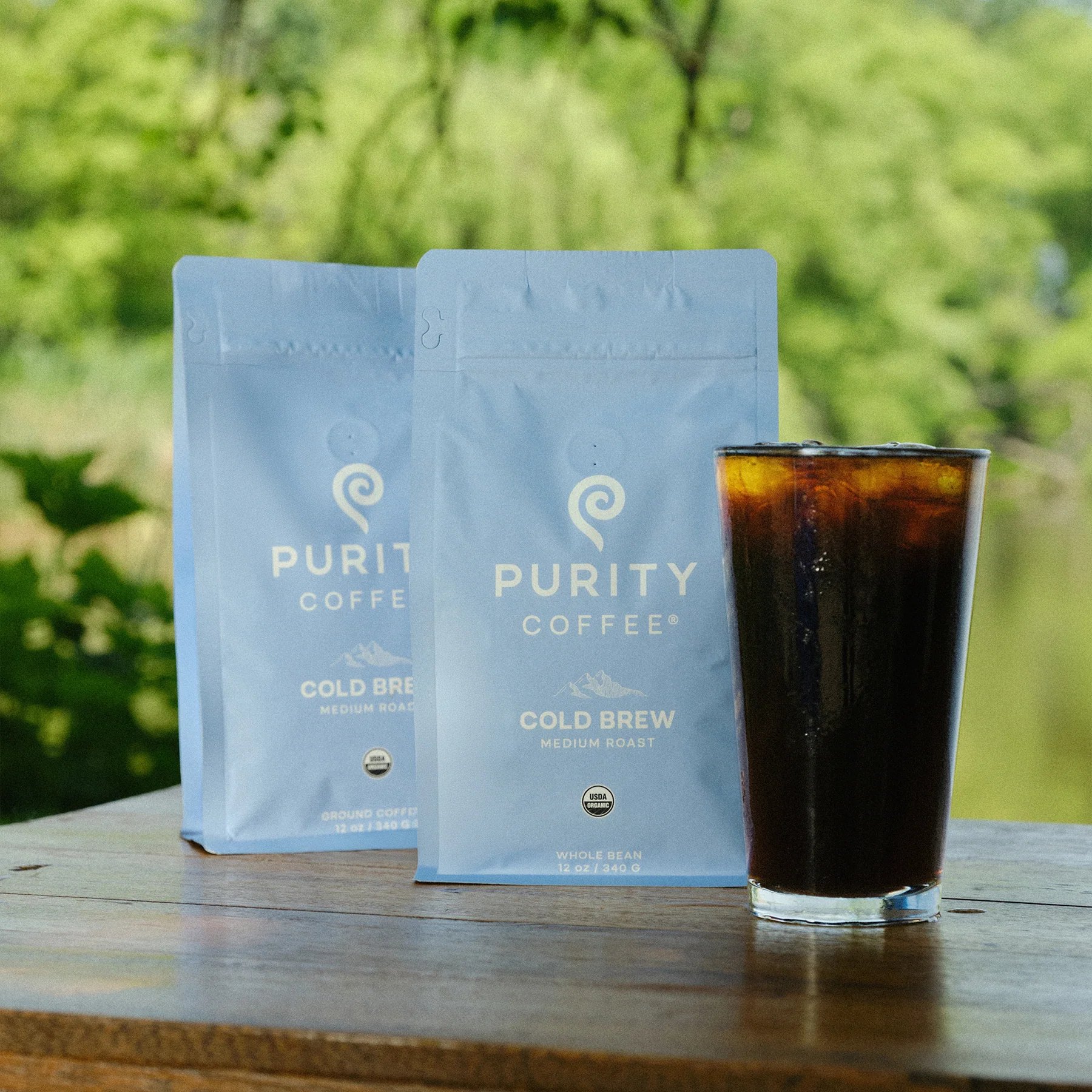 Cold Brew coffee bags paired with a poured glass outside.