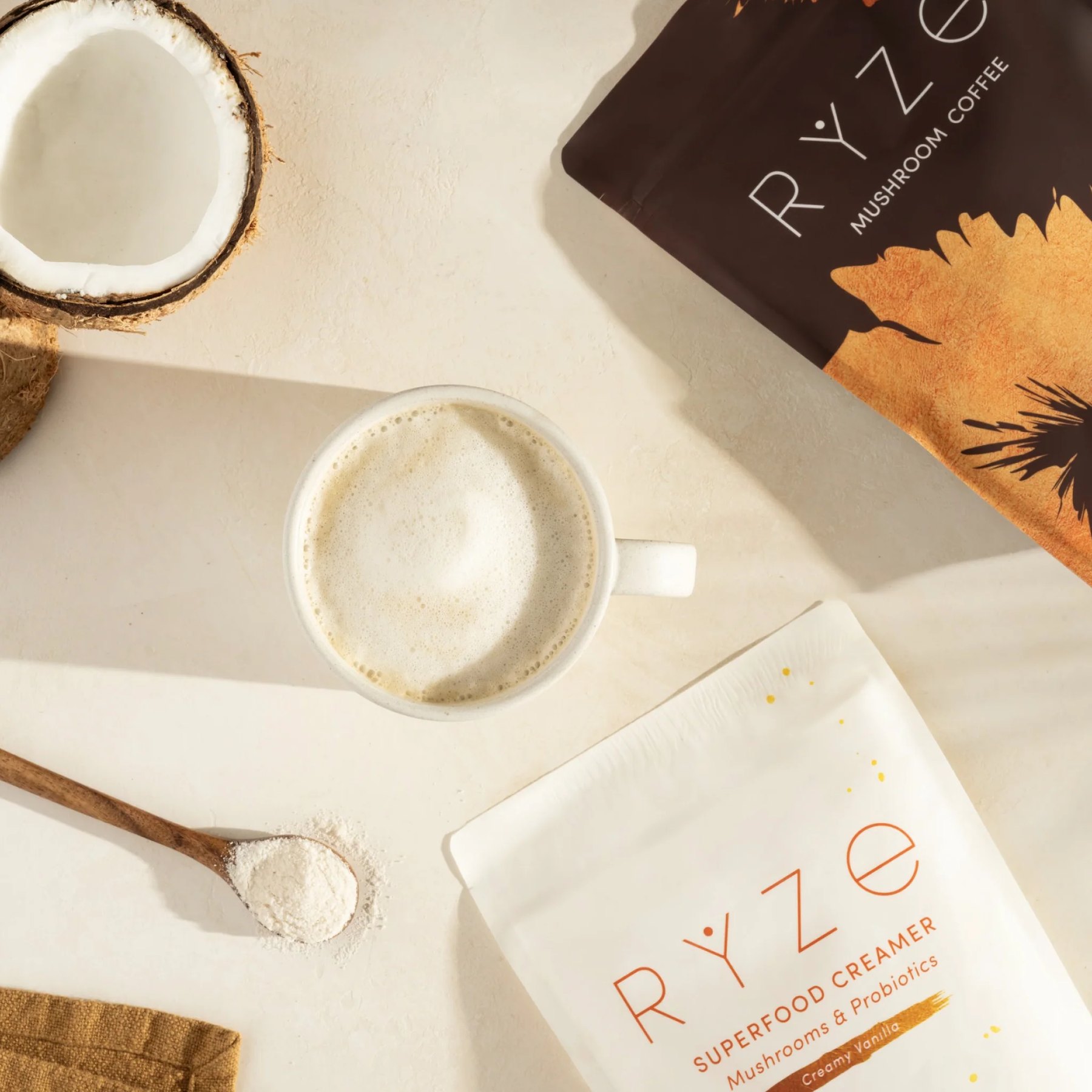 A prepared cup with powder spoon coconut and product pouches.